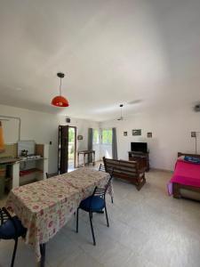 a living room with a table and a couch at Caminito in Villa Anizacate