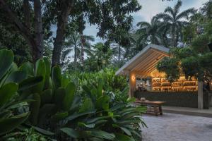 a restaurant in the middle of a garden at Arde La Selva in Santa Fe de Antioquia