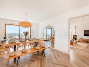 a dining room and living room with a table and chairs at The Beaches in Berwick-Upon-Tweed