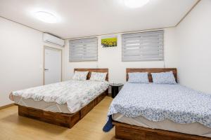 En eller flere senge i et værelse på MIN-Stay