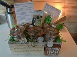 a box filled with jars of food on a table at Lakeview Lodge- Uk40692 in Crowhurst +20 photos