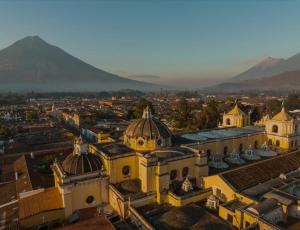 an aerial view of a city with mountains in the background at Private Studio, Very Centric and Flexible Check-In in Antigua Guatemala