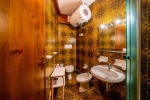 a bathroom with a sink and a toilet at Cervinia Ski In Ski Out - Peak Studio in Breuil-Cervinia