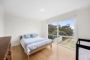 Ένα ή περισσότερα κρεβάτια σε δωμάτιο στο Rally House Fairhaven