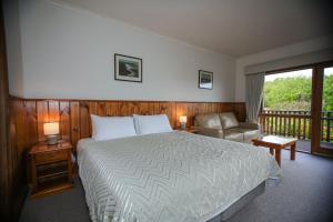 Voodi või voodid majutusasutuse Daysy Hill Country Cottages toas