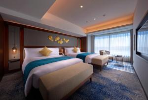 a hotel room with two beds and a window at Villa Fontaine Grand Haneda Airport in Tokyo +165 photos