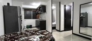 Kuchyň nebo kuchyňský kout v ubytování VACACIONES CON AROMA DE CAFÉ - Apartamento Vacacional cerca a Parque del Café