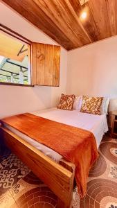 a bedroom with a large bed with a wooden ceiling at Hotel Hacienda Inglaterra in Sevilla +124 photos