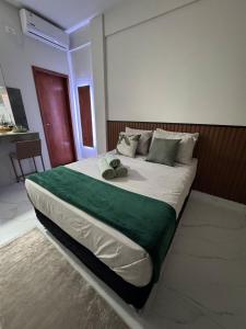 Postel nebo postele na pokoji v ubytování Monoambiente Familia Borch! Aconchego e Conforto!