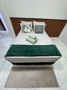 Postel nebo postele na pokoji v ubytování Monoambiente Familia Borch! Aconchego e Conforto!