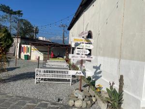 a bunch of signs on the side of a building at Universal Bliss in Pokhara +4 photos