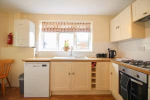 Køkken eller tekøkken på Sunny Corner Cottage