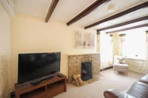 Et tv og/eller underholdning på Sunny Corner Cottage + 21 billeder