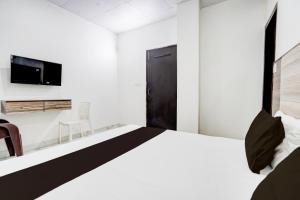 TV/trung tâm giải trí tại Hotel O Chaudhary Guest House +24 ảnh