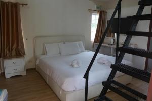 Postel nebo postele na pokoji v ubytování Evie Mae Resort + 40 fotografií