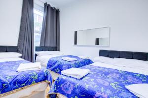 Postel nebo postele na pokoji v ubytování Joel Hotel + 12 fotografií