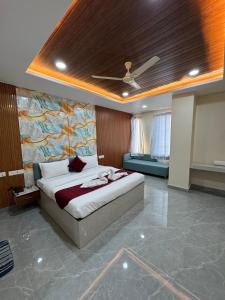 a bedroom with a bed and a ceiling at The Vizata Hotel in Jaipur