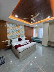 a bedroom with a bed in a room with a ceiling at The Vizata Hotel in Jaipur