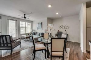 a living room with a table and a couch at Luxury 3BD Apt Smart Home Pool Grapevine GV202 in Minters Chapel