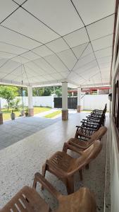 a row of chairs sitting under a white tent at The Grace Cottage - Negombo in Dagonna
