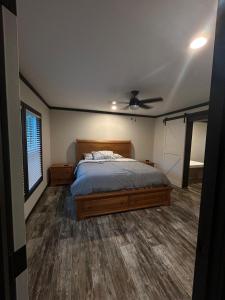 a bedroom with a bed and a ceiling fan at Panther Creek retreat in Clarkesville +3 photos