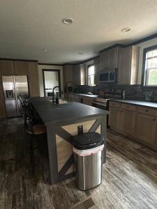a kitchen with a large island in the middle of it at Panther Creek retreat in Clarkesville