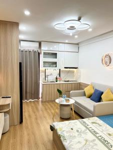 a living room with a couch and a table at Evergreen Bac Giang apartment in Bắc Giang