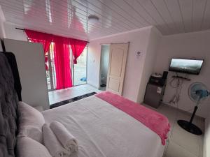 a bedroom with a large bed and a window at No 1 Guest house in Cape Town +62 photos