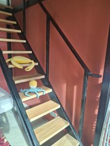 a stair case in a house with wooden steps at The Vicarage in Mirissa +1 photo