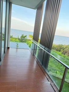 a balcony with a view of the ocean at sea l in Jakarta