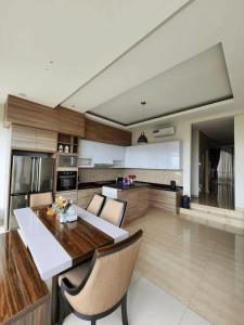 a kitchen with a table and chairs in a room at sea l in Jakarta +15 photos