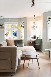 a living room with a couch and a table at Central apartement in Kristiansund in Kristiansund