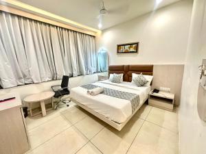 Postel nebo postele na pokoji v ubytování Hotel Apple Inn