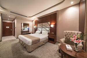 Postel nebo postele na pokoji v ubytování Sunday Red Sea Fountain Alhamra Formerly Vivid Plaza Hotel + 29 fotografií