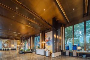a lobby of a building with a large window at Landison Plaza E-Fashion Hotel Hangzhou in Hangzhou