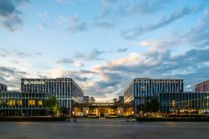 a view of two tall buildings at dusk at Landison Plaza E-Fashion Hotel Hangzhou in Hangzhou