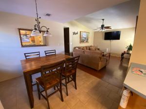 a living room with a dining room table and a couch at The Yellow Bench House in Long Beach