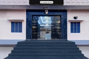 a door to a building with stairs in front at Collection O Amer Jaipur Formerly Khandaka Villa in Jaipur