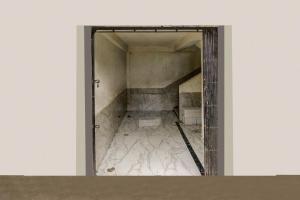 an open door to a room with a stair case at Super Collection O Ulhasnagar Birla Temple Formerly Hotel Yash Residency in Ulhasnagar