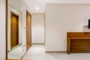 TV a/nebo společenská místnost v ubytování Super Townhouse Oak Sevoke Road Siliguri