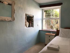 Voodi või voodid majutusasutuse Foal Barn Cottages - The Smithy - Spennithorne toas +4 fotot