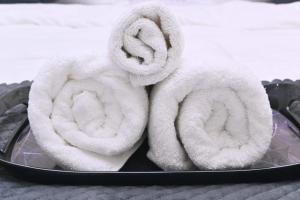 a plate with towels on top of it at Sunaina Palace in Varanasi