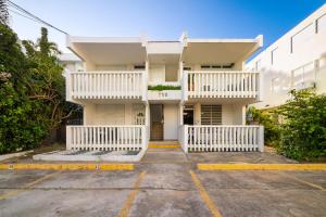 an empty parking lot in front of a building at Beach Side House Amazing For Family and Group by PH in Luquillo