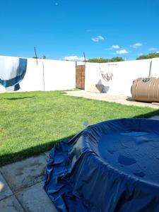 a blue tarp on the grass in a yard at Small town comfort in Marquard