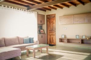 a living room with a couch and a table at Penthouse by Grit Villas - Penthouse Apartment with a Private Pool in Negombo