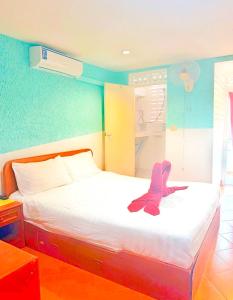 Postel nebo postele na pokoji v ubytování Suki Palm