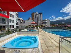 Bazén v ubytování Apartamento con Excelente Vista con Piscina, Jacuzzi, BBQ y Balcón nebo v jeho okolí