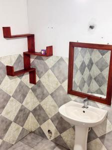 a bathroom with a sink and a mirror at Wave Loom Hostel Ahangama in Ahangama +50 photos