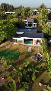 an aerial view of a house with a yard at Heaven Retreat with Minigolf, pool, fire pit, BBQ in Nadi