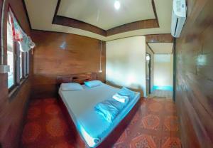 Ένα ή περισσότερα κρεβάτια σε δωμάτιο στο Mama Mon & Papa's